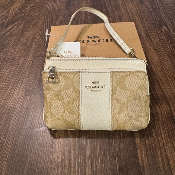 Coach Handbags - Coach light/khaki/chalk signature PVC  leather double zip wallet